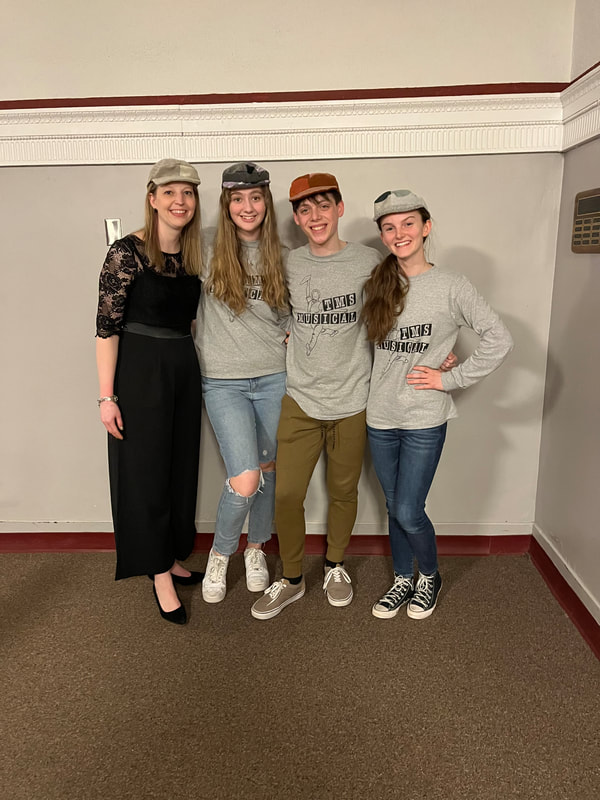 Stephanie is pictured with her student directors of Titusville Middle School's 2023 production of "Newsie's Jr.". 